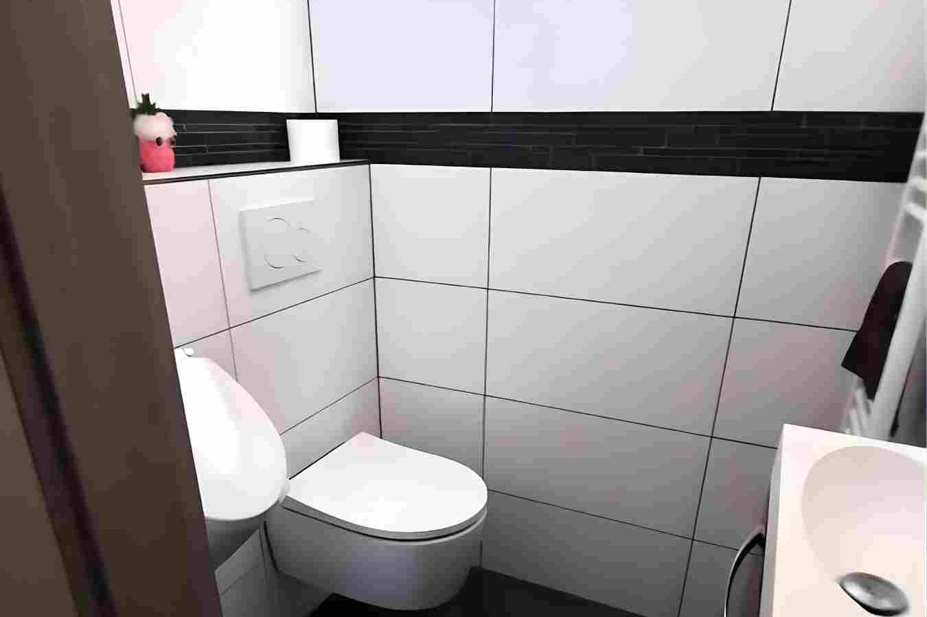 Saniertes Gästebad in Köln der Raumgestaltung Breuer Kleines Badezimmer mit weißer Wandfliesen, Toilette und Waschbecken. Neu gestaltet durch Raumgestaltung Breuer.
